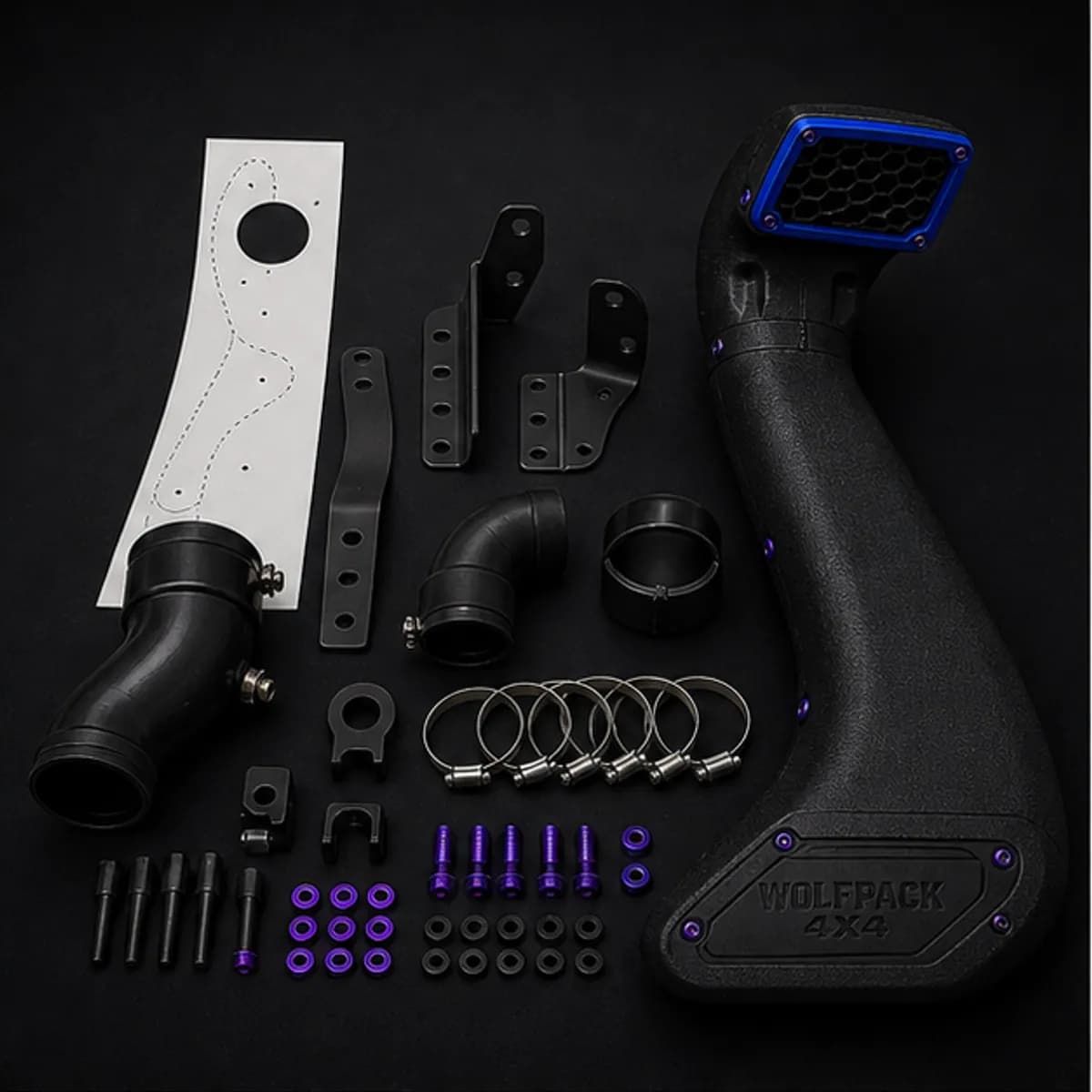 4x4 air intake systems | Wolfpack 4x4 Cold air induction kit with filter, couplers and intake piping on a workshop bench
