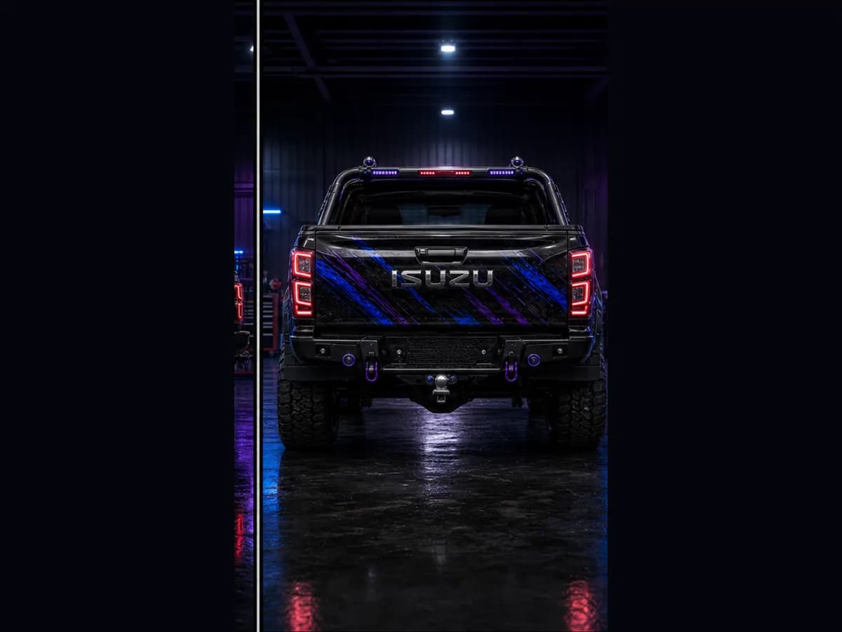 Back view of an Isuzu D-MAX Blade with Isuzu badge and Wolfpack wrap