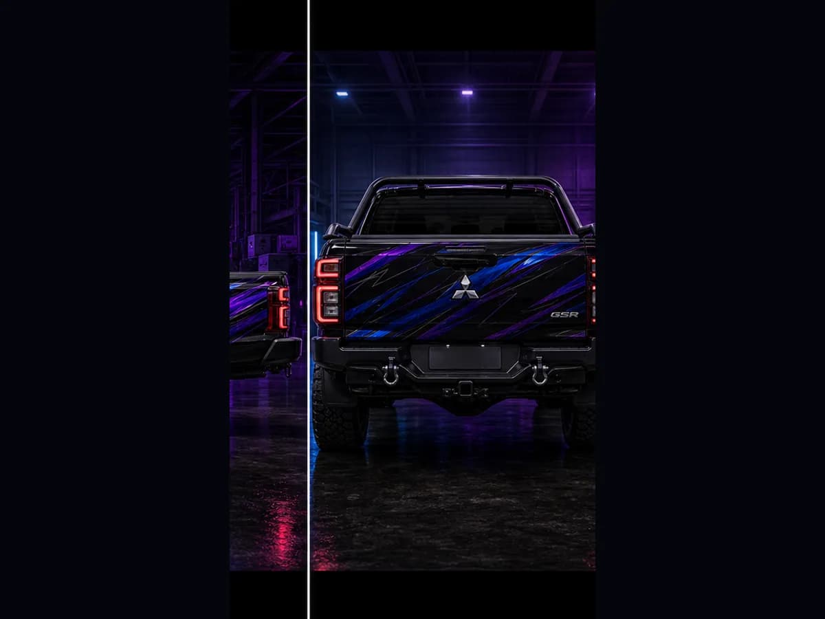 Back view of a Mitsubishi Triton GSR with Mitsubishi badge and Wolfpack wrap