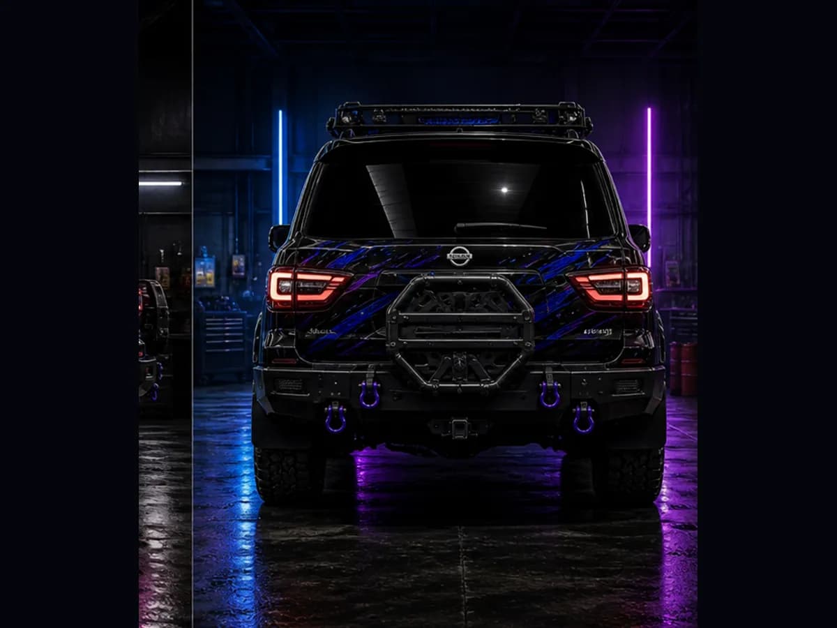 Back view of a Nissan Patrol Warrior with Nissan badge and Wolfpack wrap