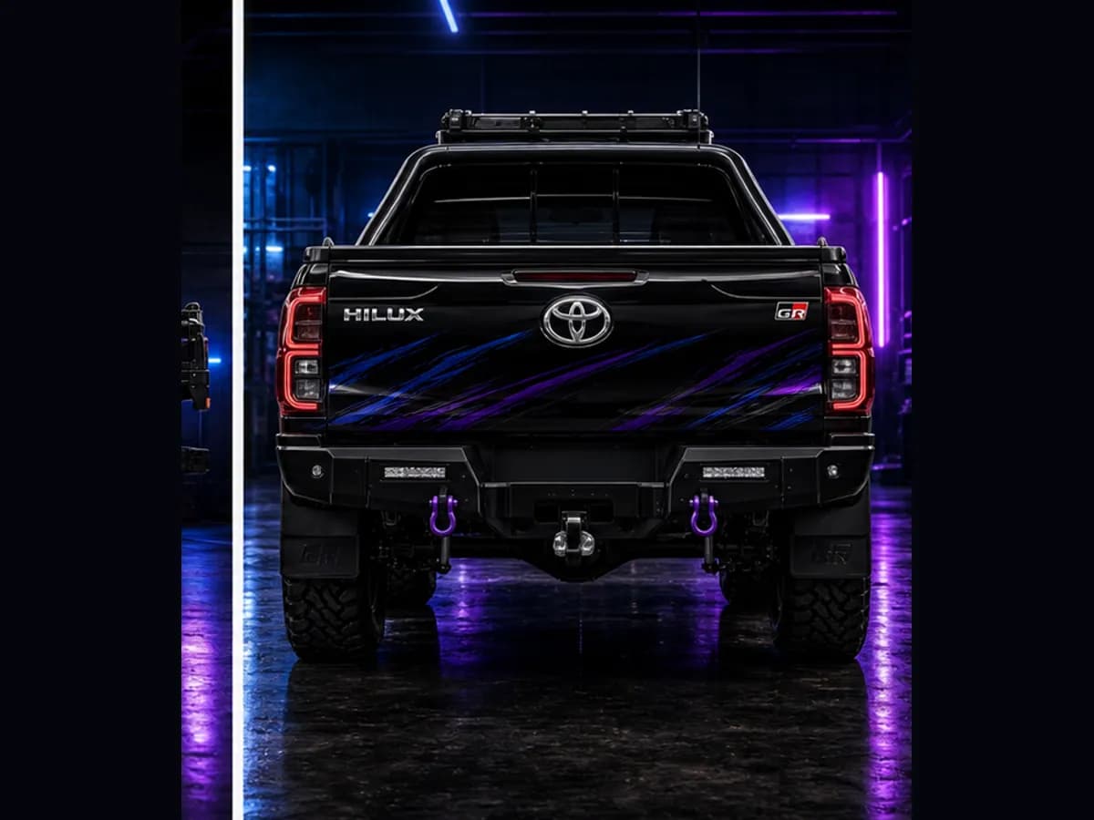Back view of a Toyota HiLux GR Sport with Toyota badge and Wolfpack wrap