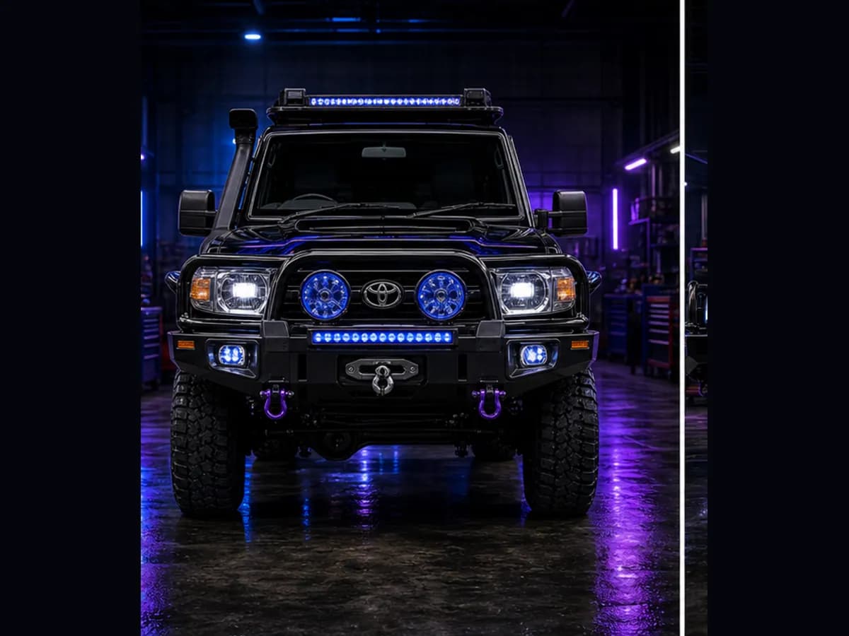 Front view of a Toyota LandCruiser 79 with Toyota badge and Wolfpack wrap
