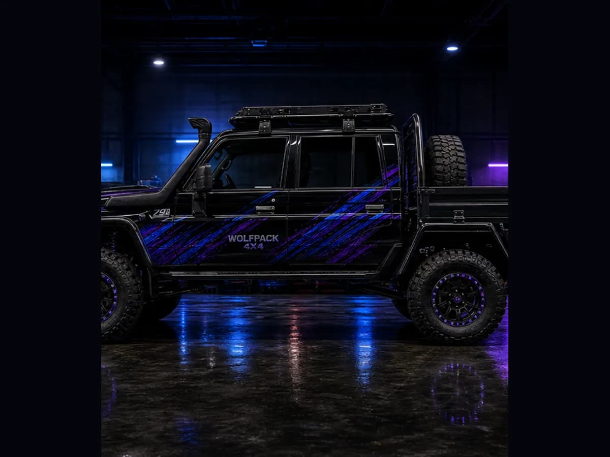 Side view of a Toyota LandCruiser 79 with Wolfpack wrap